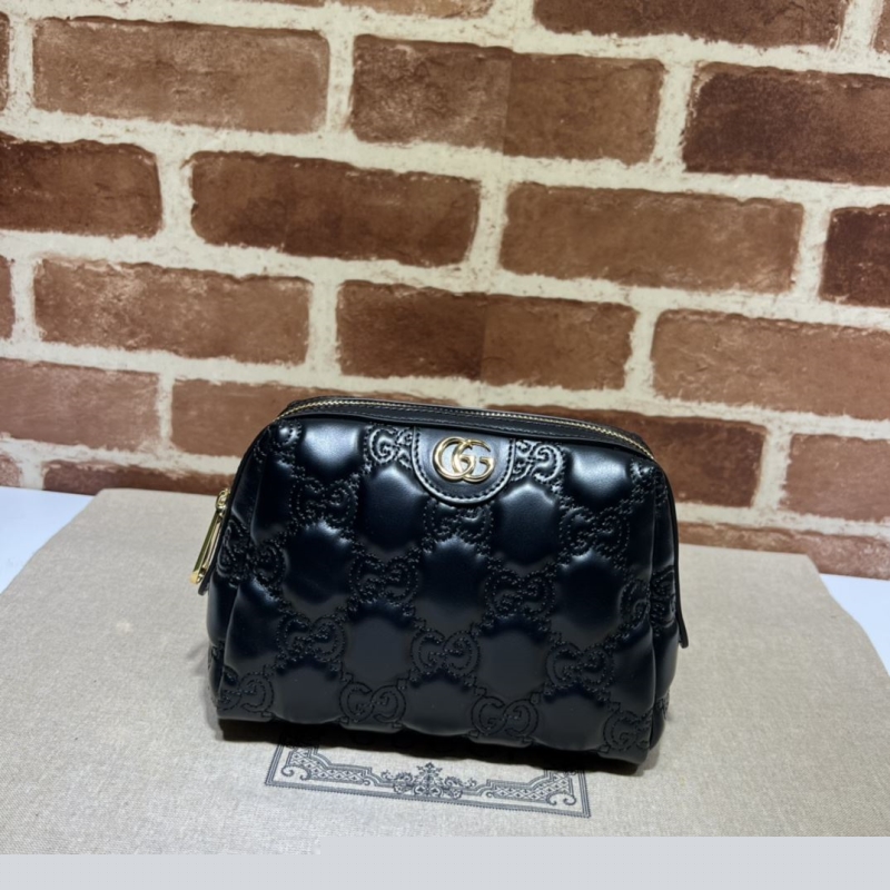 G*u*i clutch bags
